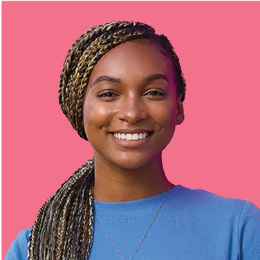 Smiling person with long braided hair, wearing a blue shirt, against a pink background.
